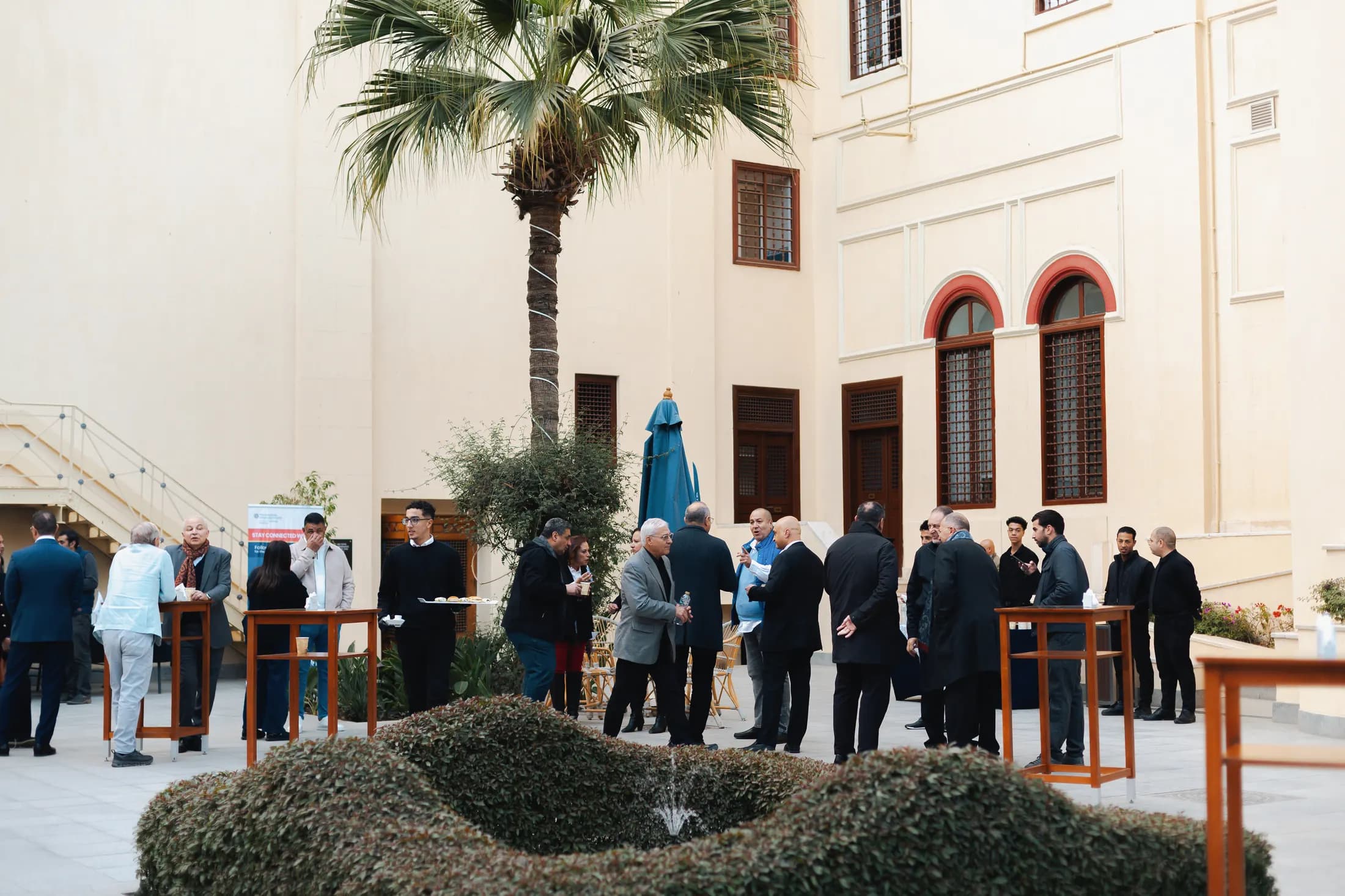 Members gathered across the courtyard between sessions