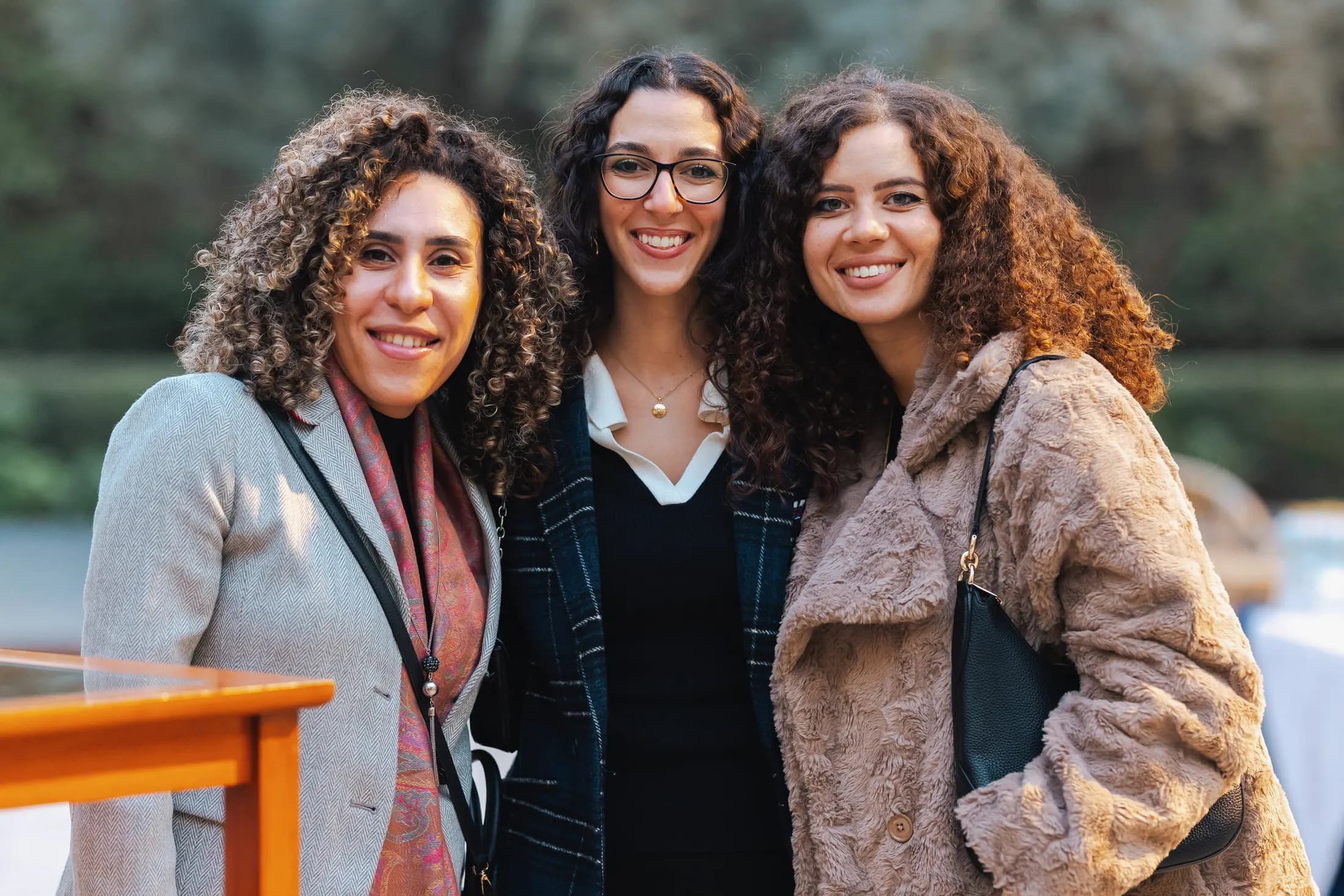 Three PGAE members together at a gathering